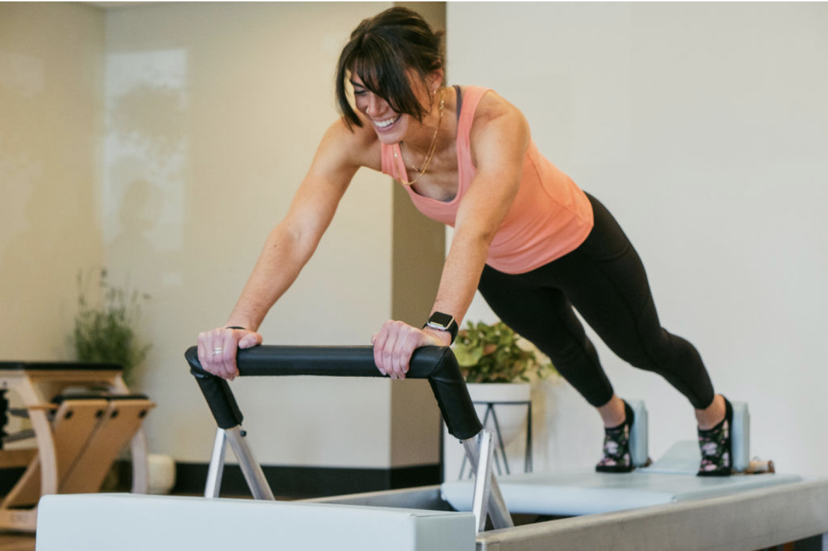 Pregnant woman doing pilates